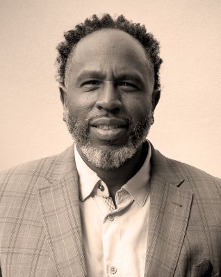 A man in a checkered sport coat