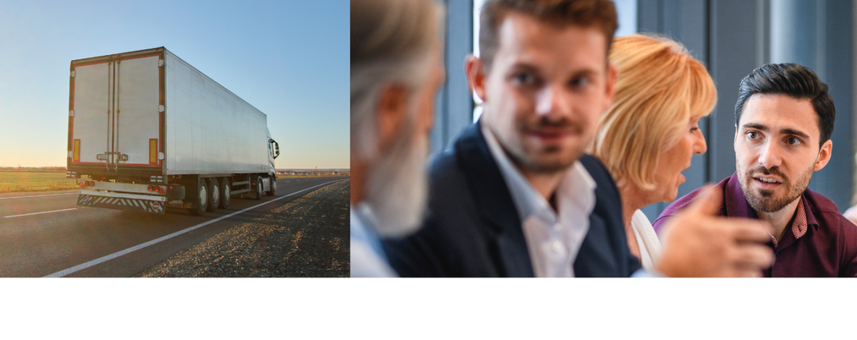 A truck moves down the highway on the left side of the screen, while a group of talkative executives have an engaging meeting on the right.
