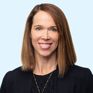 Photo of a woman with a big smile looking right at the camera